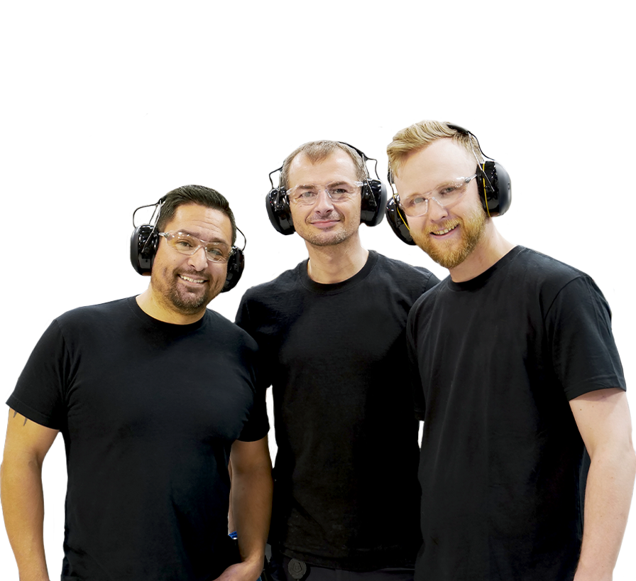 Three Silver King Beverage employees with happy expressions are wearing black t-shirts.