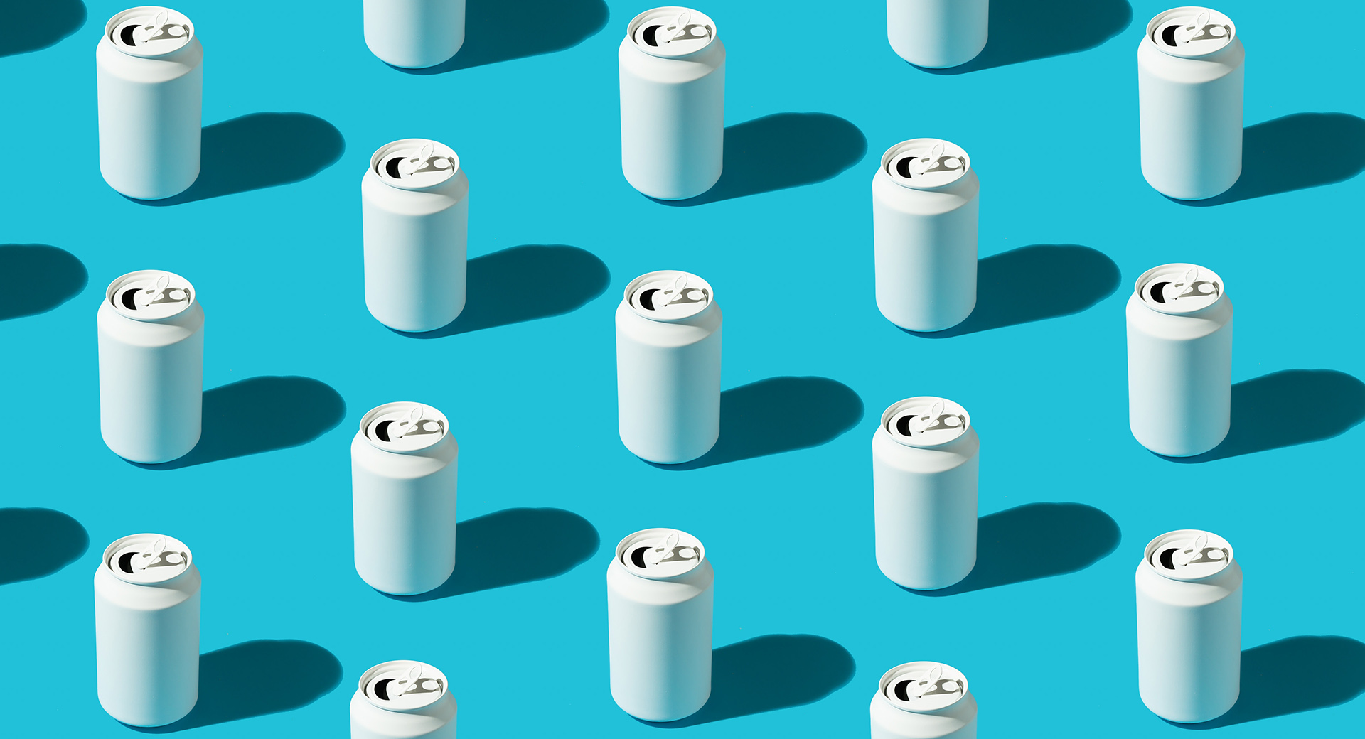 White beverage cans pattern on the bright blue background