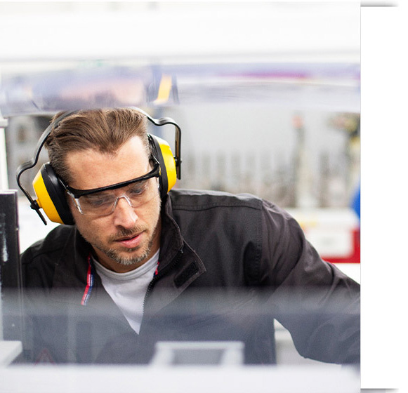 Production employee working on line
