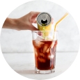 Beverage being poured from a can into a glass